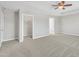 Bedroom featuring multiple doors and carpet at 120 Cobblebrook Ct, Holly Springs, NC 27540
