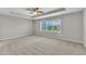Bedroom featuring a tray ceiling and carpet at 120 Cobblebrook Ct, Holly Springs, NC 27540