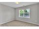 Cozy bedroom with neutral carpet and bright window at 120 Cobblebrook Ct, Holly Springs, NC 27540