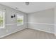 Bedroom features two windows and fresh carpet at 120 Cobblebrook Ct, Holly Springs, NC 27540