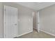 Neutral bedroom with carpet, open closet door, and electrical outlets at 120 Cobblebrook Ct, Holly Springs, NC 27540