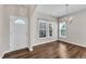 Dining room with wood floors and natural light, perfect for Gathering gatherings at 120 Cobblebrook Ct, Holly Springs, NC 27540