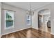 Elegant dining area with chandelier and wood floors, ideal for entertaining and Gathering meals at 120 Cobblebrook Ct, Holly Springs, NC 27540