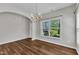 Dining room with wood floors, chandelier, and natural light, perfect for Gathering dinners at 120 Cobblebrook Ct, Holly Springs, NC 27540