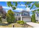 Lovely home with manicured lawn and mature evergreens, offering a welcoming and picturesque view at 120 Cobblebrook Ct, Holly Springs, NC 27540