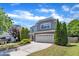 Beautiful home with lush landscaping, a well-kept lawn, and a charming, inviting curb appeal at 120 Cobblebrook Ct, Holly Springs, NC 27540