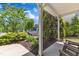 Cozy porch view with garden and greenery, perfect for relaxing outdoors at 120 Cobblebrook Ct, Holly Springs, NC 27540
