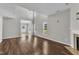 Spacious living room with beautiful hardwood floors and a fireplace at 120 Cobblebrook Ct, Holly Springs, NC 27540