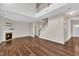 The expansive living room includes a staircase to the second floor and a fireplace, ideal for relaxation and gatherings at 120 Cobblebrook Ct, Holly Springs, NC 27540