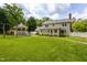 Expansive backyard featuring a gazebo, swing set, and plenty of green space for outdoor enjoyment at 1213 Indian Trail Dr, Raleigh, NC 27609