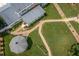 A bird's eye view of the backyard, highlighting the landscaped paths, gazebo, and lush greenery, ideal for outdoor enjoyment at 1213 Indian Trail Dr, Raleigh, NC 27609