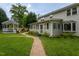Well-maintained backyard featuring a gazebo and a winding brick path through the green grass at 1213 Indian Trail Dr, Raleigh, NC 27609
