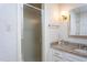 Bathroom featuring a glass enclosed shower and granite counter at 1213 Indian Trail Dr, Raleigh, NC 27609