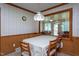 A formal dining area with a view of the backyard through a large glass window at 1213 Indian Trail Dr, Raleigh, NC 27609
