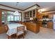 Traditional kitchen with oak cabinets, stainless steel appliances, and an adjacent dining area at 1213 Indian Trail Dr, Raleigh, NC 27609