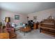 Cozy living room with seating, a desk, an organ, and a round coffee table at 1213 Indian Trail Dr, Raleigh, NC 27609