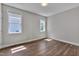 Bright bedroom features wood-look floors and two windows with charming shades at , Chapel Hill, NC 27516