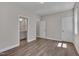 Bedroom features wood-look floors and doors to a bathroom and hallway at , Chapel Hill, NC 27516