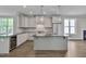 Contemporary kitchen featuring a center island, stainless steel appliances, and an open layout at , Chapel Hill, NC 27516