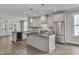 Modern kitchen featuring an island with countertop seating, stainless steel appliances, and sleek cabinetry at , Chapel Hill, NC 27516