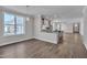 The living area opens to the kitchen, featuring recessed lights, hardwood flooring, and large windows at , Chapel Hill, NC 27516