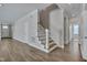 Open living room showcases hardwood floors and staircase to the upper level at , Chapel Hill, NC 27516