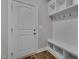 Mud room featuring a bench and coat hooks with storage cubbies at 127 Post Oak Rd, Chapel Hill, NC 27516