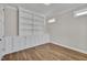 Well-lit office featuring built-in shelving and cabinetry, wood floors, and bright windows at , Chapel Hill, NC 27516