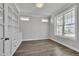 Home office offers built-in shelving, large windows and hardwood floors at 127 Post Oak Rd, Chapel Hill, NC 27516