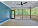Covered porch featuring beadboard ceiling, ceiling fan, and wooded view at , Chapel Hill, NC 27516