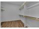 Spacious walk-in closet with custom shelving and hardwood floors at , Chapel Hill, NC 27516