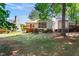 View of the backyard with a deck and a screened in porch at 140 Heatherwood Dr, Apex, NC 27502