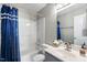 Well-maintained bathroom featuring a shower-tub combo and modern vanity at 140 Heatherwood Dr, Apex, NC 27502