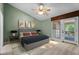 Well-furnished bedroom with a sliding glass door to the porch at 140 Heatherwood Dr, Apex, NC 27502