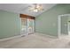 Bright bedroom featuring a sliding glass door to the porch at 140 Heatherwood Dr, Apex, NC 27502