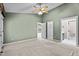Spacious bedroom featuring multiple doorways and access to the bathroom at 140 Heatherwood Dr, Apex, NC 27502