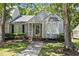 Charming home featuring a bay window, landscaped yard and welcoming front porch at 140 Heatherwood Dr, Apex, NC 27502
