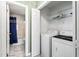 Convenient laundry area featuring a washer, dryer, and built-in shelving at 140 Heatherwood Dr, Apex, NC 27502