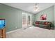Bright living room with sliding glass door to porch, couch and fish tank at 140 Heatherwood Dr, Apex, NC 27502