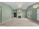 Bright living room featuring vaulted ceilings, a fireplace, and large windows at 140 Heatherwood Dr, Apex, NC 27502