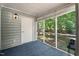 Enclosed screened porch offering views of the backyard and surrounding trees at 140 Heatherwood Dr, Apex, NC 27502