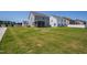 Grassy backyard with beautiful neighborhood views and large trees at 147 Antler Steel Dr, Clayton, NC 27527