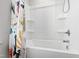 White bathtub and shower featuring chrome fixtures and a colorful shower curtain at 147 Antler Steel Dr, Clayton, NC 27527