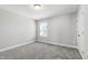 Neutral bedroom featuring a window and plush gray carpeting at 147 Antler Steel Dr, Clayton, NC 27527