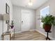Welcoming foyer with hardwood floors, fresh white paint, and a bright window at 147 Antler Steel Dr, Clayton, NC 27527