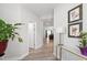 Bright hallway featuring modern decor, stylish console table, and a view of the living areas at 147 Antler Steel Dr, Clayton, NC 27527
