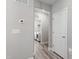 Hallway with access to laundry room featuring modern appliances, lighting and fresh paint at 147 Antler Steel Dr, Clayton, NC 27527