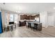 Open-concept kitchen with stainless steel appliances, granite counters, dark wood cabinetry, and an island perfect for entertaining at 147 Antler Steel Dr, Clayton, NC 27527