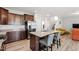 Spacious kitchen featuring a large island with seating, granite countertops, and stainless steel appliances at 147 Antler Steel Dr, Clayton, NC 27527