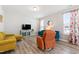 Bright living room featuring stylish furniture, neutral walls, and patterned curtains for a fresh, modern feel at 147 Antler Steel Dr, Clayton, NC 27527